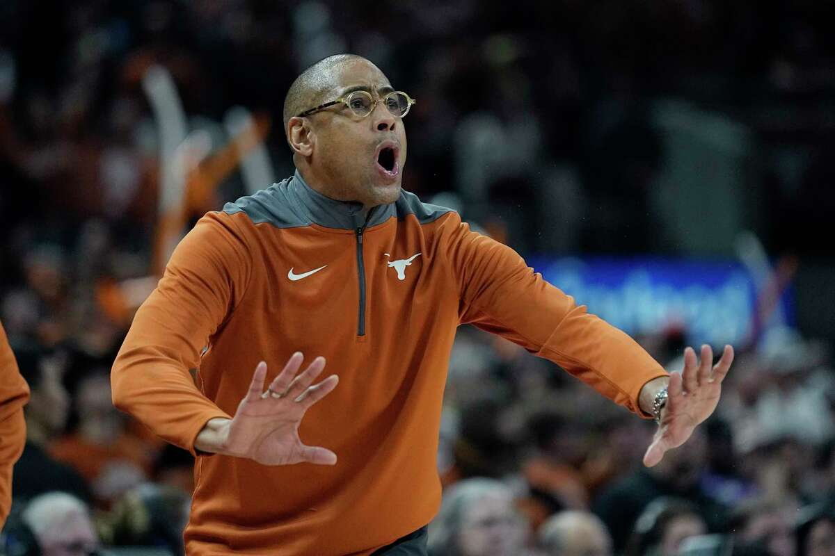 Texas acting head coach Rodney Terry talks to his players during the second half of an NCAA college basketball game against TCU in Austin, Texas, Wednesday, Jan. 11, 2023.