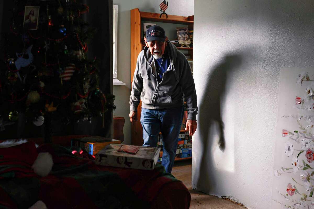 Ario Ysit, the photographer’s grandfather, walks through Victoria Christian’s home.
