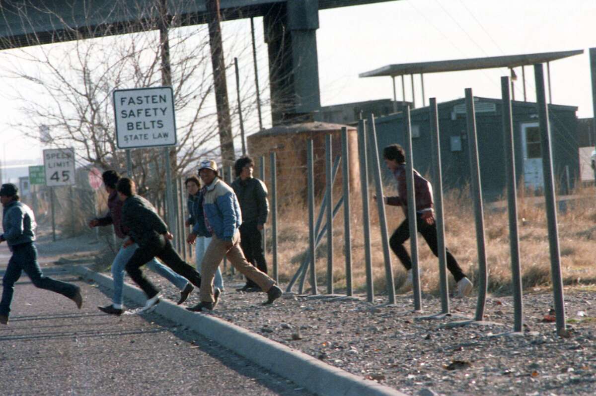 Undocumented Mexican commuters dash to their jobs on the U.S. side of the border, from Juarez, Mexico, to El Paso in February 1987. 