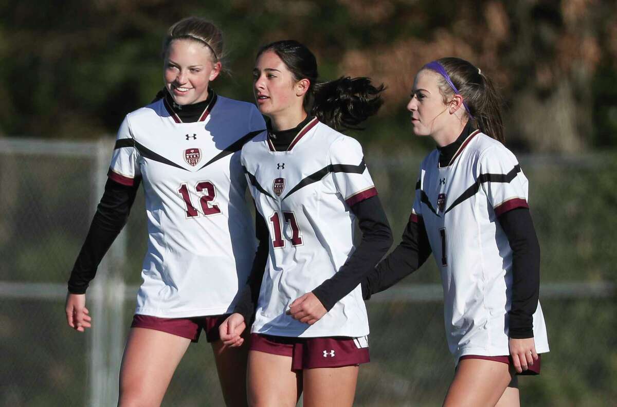 Magnolia West's Avery Riley (17) is seen alongside Amie Sumrall (12) and Grayson Bertrand (1) after scoring a goal during a high school soccer match at the Kat Cup soccer tournament at Willis High School, Friday, Jan. 13, 2023, in Willis.
