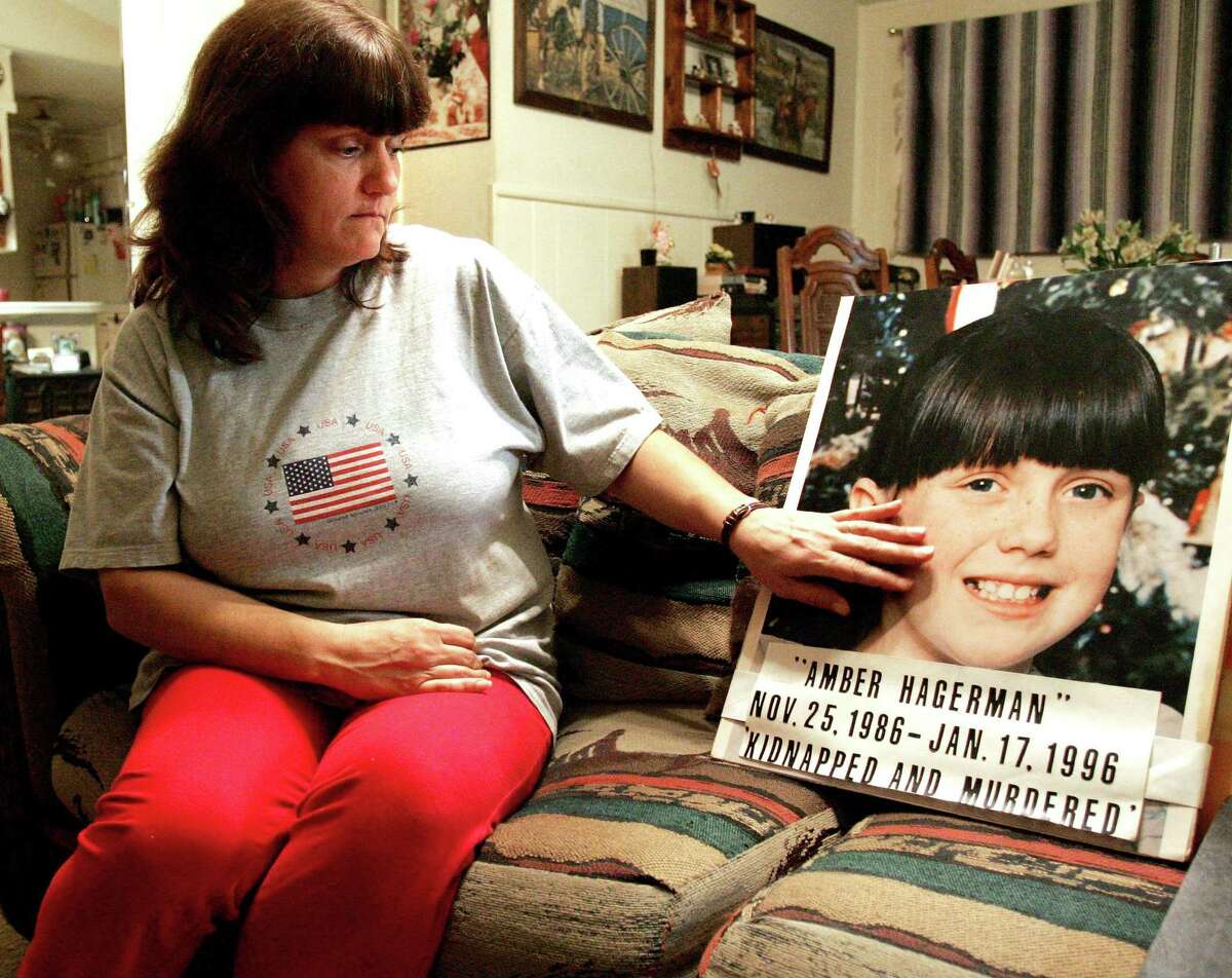 Donna Williams, whose last name was Whitson at the time of her daughter’s abduction in 1996, touches a photograph of her daughter, Amber Hagerman, in January 2006. Amber was 9 years old when she was kidnapped on Jan. 13, 1996. The case, which remains unsolved, led to the creation of the Amber Alert system.