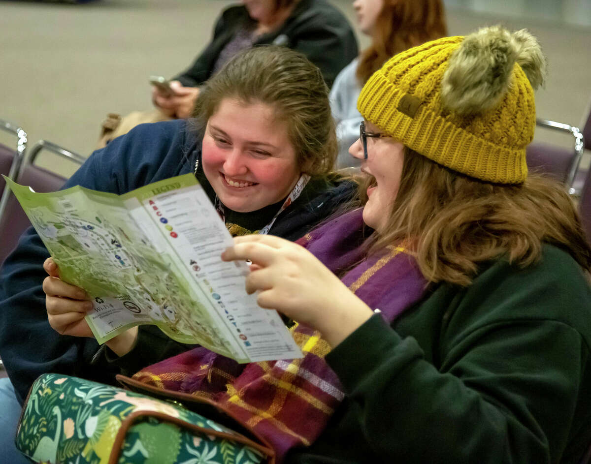 Alexis Bell, left, of Grafton, and Hayleigh Clothier, of Elsah, study a map of Lewis and Clark Community College's Godfrey campus at student orientation last week. About 40 newly-minted Trailblazers attended the event.