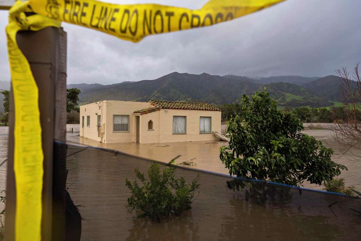 California storms: Officials warn of ongoing risk from rains, flooding. A house is submerged in floodwaters from the Salinas River in Chualar, Calif., Friday, Jan. 13, 2023.