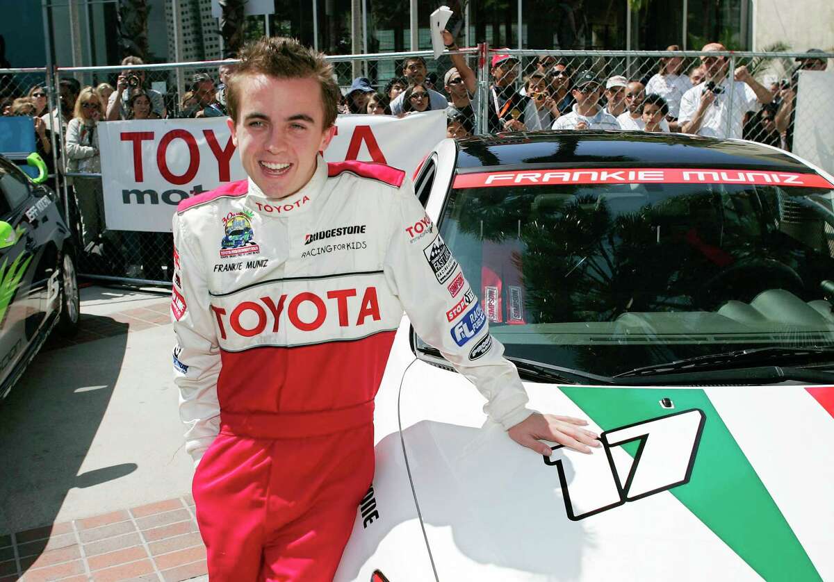 Actor Frankie Muniz poses next to his car prior to the Pro/Celebrity race at the Grand Prix of Long Beach in 2006. Muniz, 37, will race in the ARCA series this year.