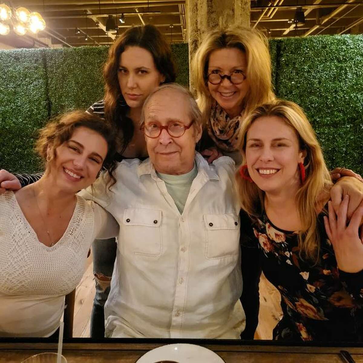 Chevy Chase and his wife Jayni enjoy dinner at The Wheel restaurant in Stamford with their daughters.