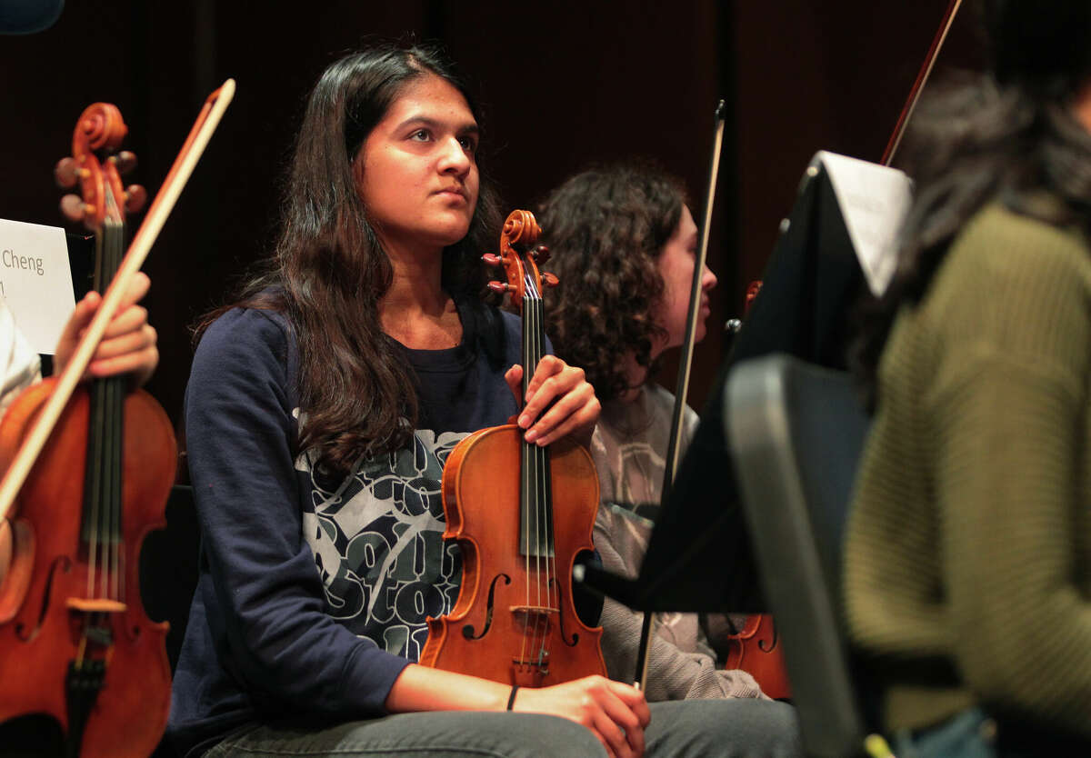 Greenwich High student Divya Shenoy takes part in the Western Region Symphony Orchestra's rehearsal of Beethoven's Edmonton Overture in preparation for the Western Region Music Festival at Greenwich High School in Greenwich, Conn., on Friday January 13, 2023. There are over 400 musicians, representing 31 schools, including 82 students from GHS, The students are performing in a chorus, symphony orchestra and jazz ensemble, among others.