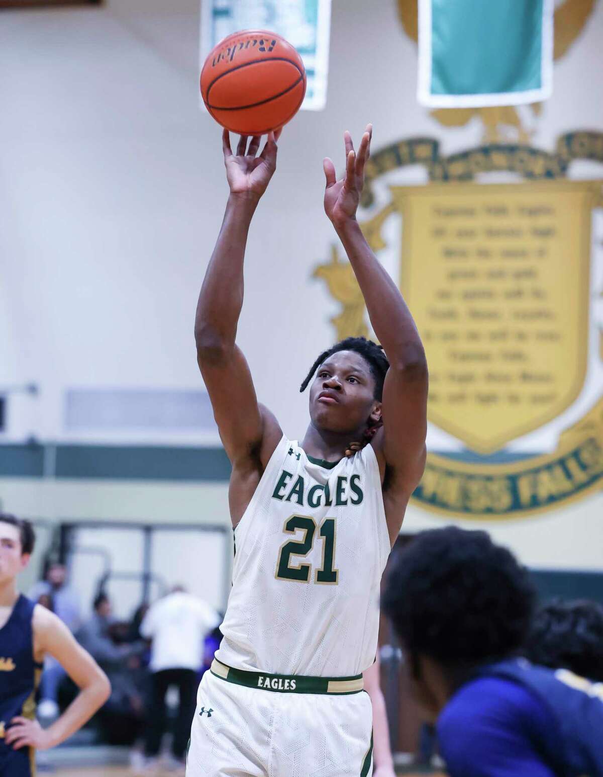 Cy Falls Joseph Tugler (21) shoots a free-throw in the second half of a District 16-6A boys high school basketball game between the Cypress Falls Eagles and the Cypress Ranch Mustangs at Cypress Falls High School in Houston, TX on Friday, January 13, 2023. Cy Falls beat Cy Ranch 50-30.