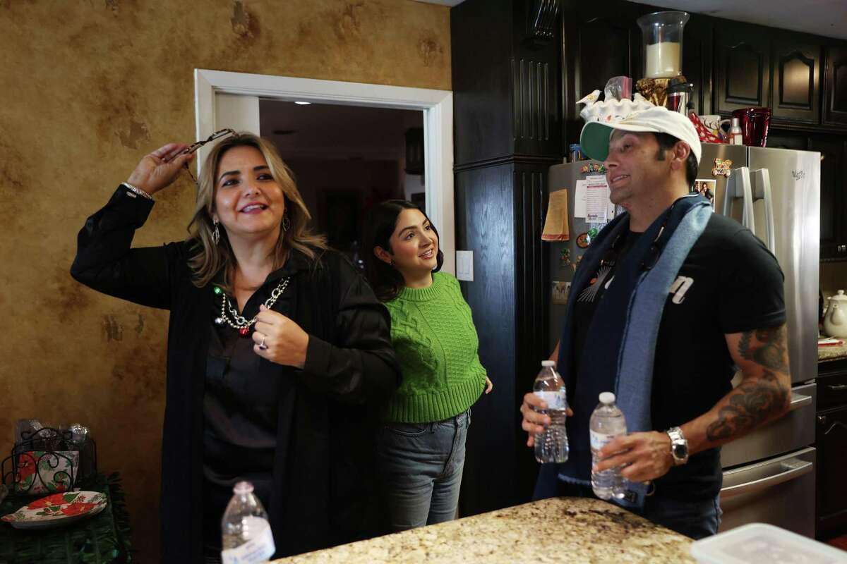 At his home in Eagle Pass, Texas, former Texas State Rep. Poncho Nevárez talks with his wife, Rossy, and daughter, Renata, before heading to a recording studio in Piedras Negras, Mexico, Tuesday, Dec. 20, 2022. Nevárez hit a staggering new low when in 2019 he accidentally dropped an envelope full of cocaine baggies while at the Austin airport, the undeniable physical proof of an addiction problem that had been festering for months. Three years later, he's managed to take back control of his life. He's clean, he's back to practicing law, and he's even embarked on a music career that's been a healthy outlet for expressing his feelings about his journey to recovery.