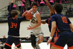 Boys basketball: Reagan stays in command in 28-6A
