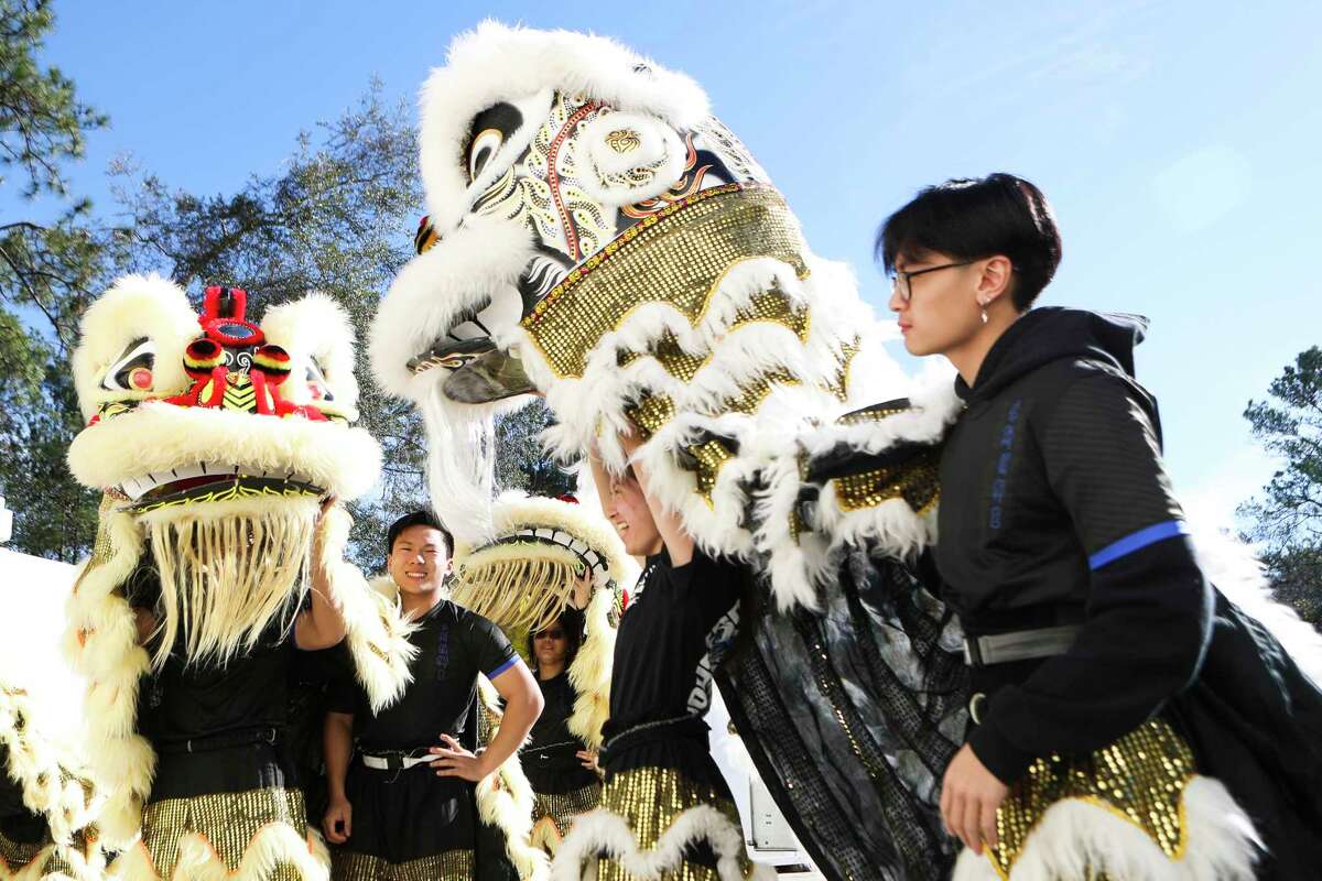 Performer Dianna Nguyen, center, with the Celestial Dragon Houston Lion Kings prepares to take part in a lion dance during The Woodlands Children’s Museum’s Lunar New Year celebration, Saturday, Jan. 14, 2023, in The Woodlands. The Lunar New Year is a 15-day celebration of the arrival of spring and beginning of a new year based on the lunisolar calendar.