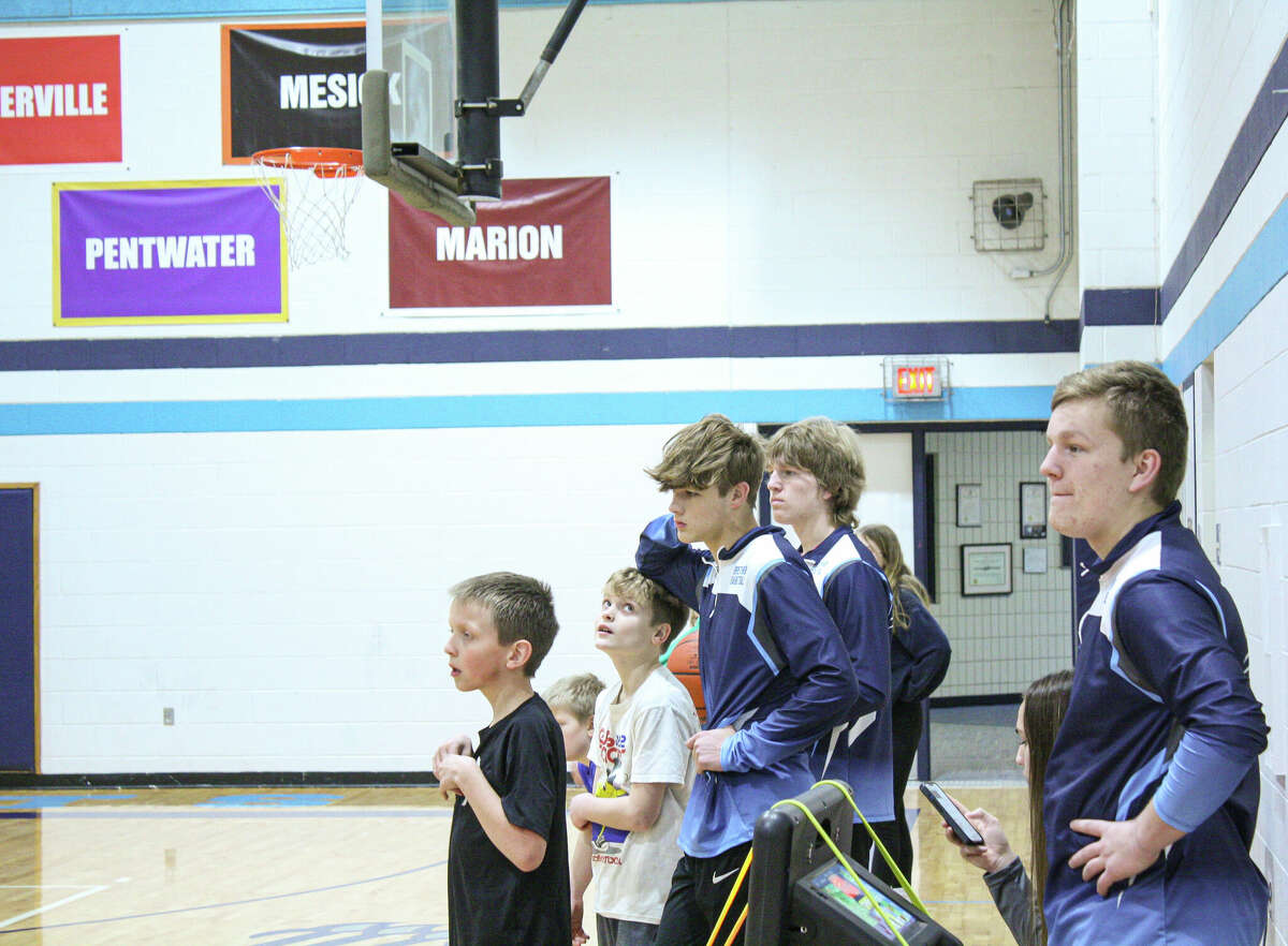Campers and coaches look on at a scrimmage during camp on Jan. 14 at Brethren High School. 