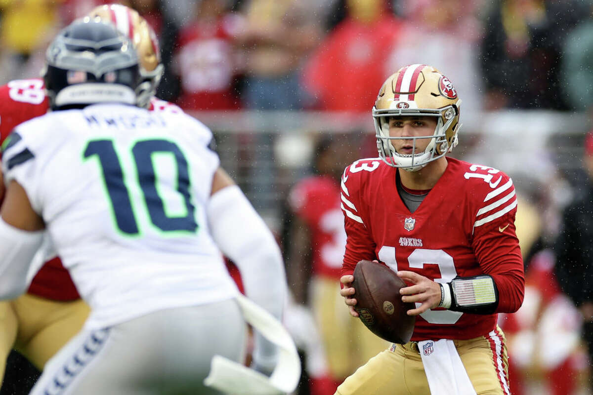 Brock Purdy of the San Francisco 49ers looks to pass against the Seattle Seahawks during the first quarter in the NFC wild-card playoff game at Levi's Stadium in Santa Clara, Calif., on Saturday.