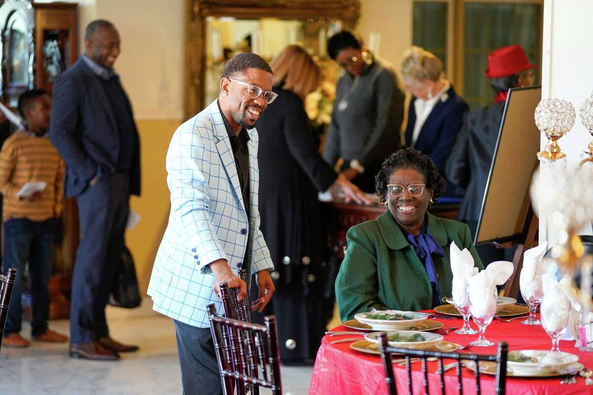 Dominique Anderson talks with guests during the fifth annual Authors Summit at Magnolia Gardens on Saturday. The event was hosted by the Martin Luther King Jr. Foundation.