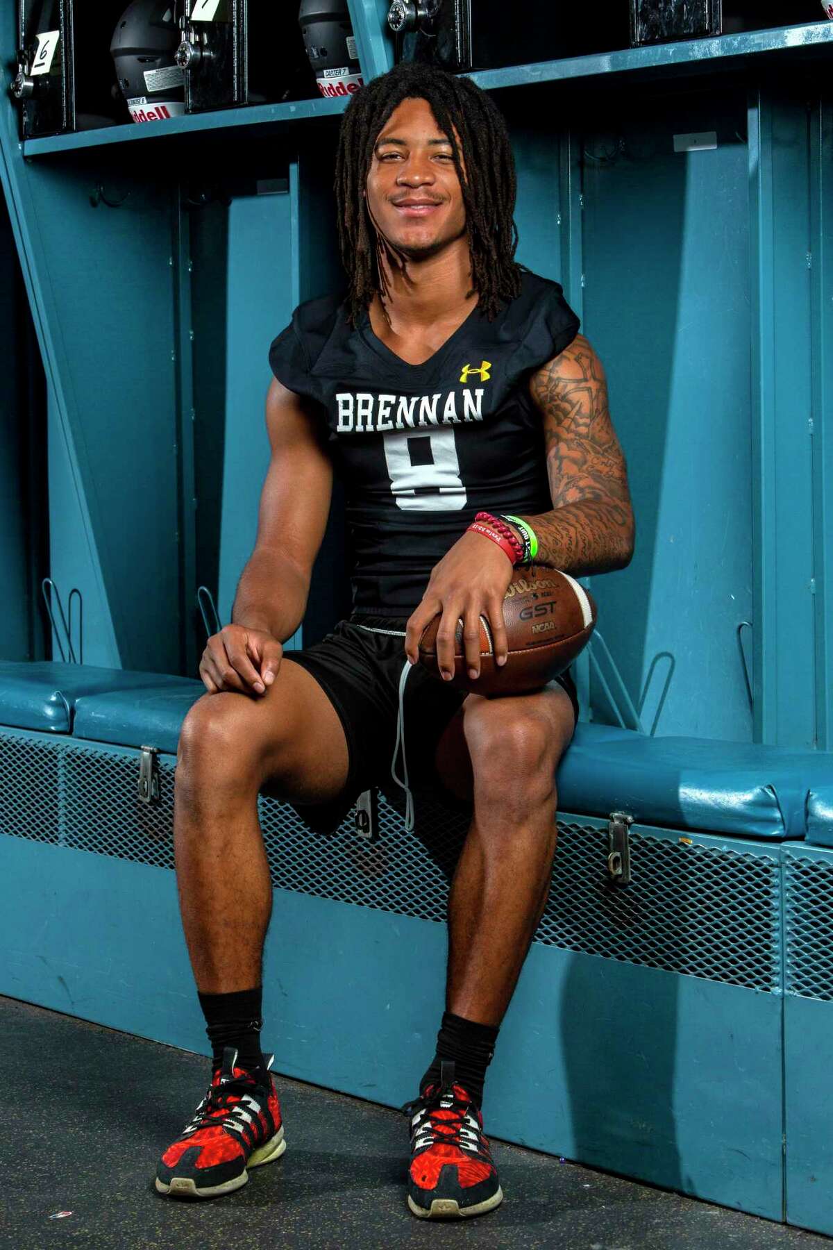 Ashton Dubose poses Aug. 2, 2022 in the Brennan High School locker room.