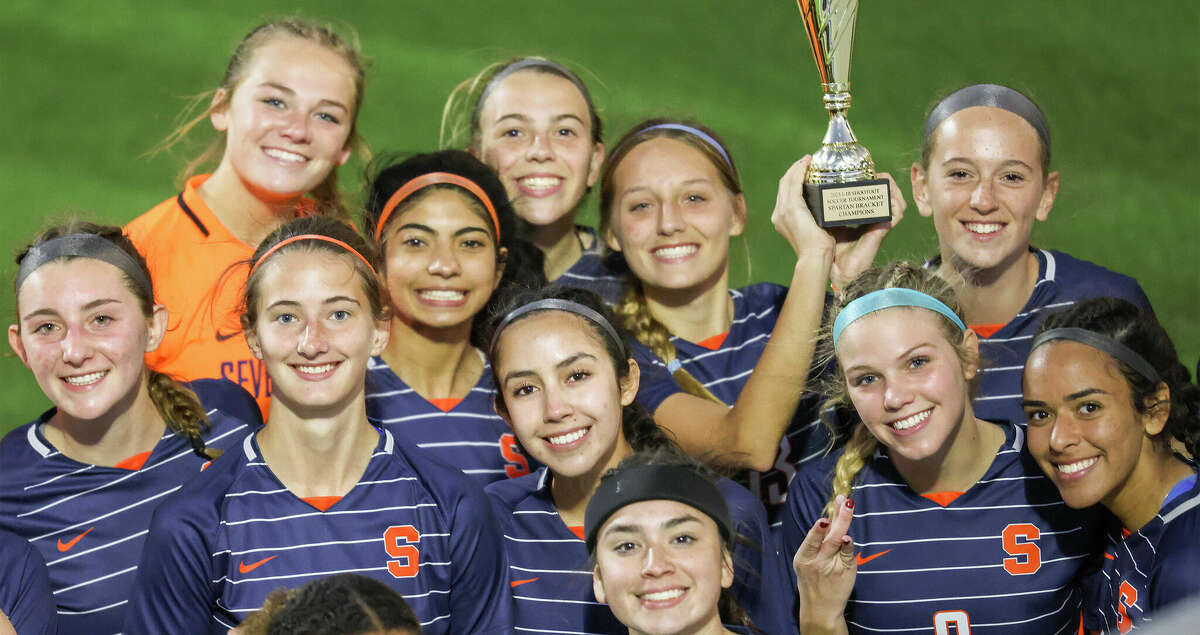 Seven Lakes holds the Championship trophy after defeating Cypress Woods in the I-10 Shootout, Spartan Bracket final on January 14, 2023 at Legacy Stadium in Katy, TX.