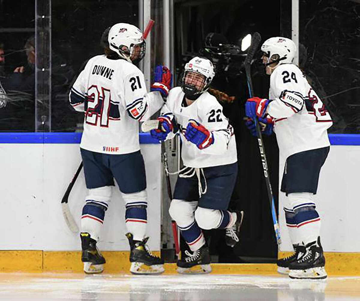 Cassie Hall of the United States (22) is greeted by Joy Dunne (21) and Maggie Scannell (24) as she takes to the ice for semifinal round action against Sweden Saturday at the U18 Women's World Championships in Ostersund, Sweden. Sweden won 2-1, but Dunne, who trains with Eliite Hockey School of East Alton was later named one of the tournament's top players.