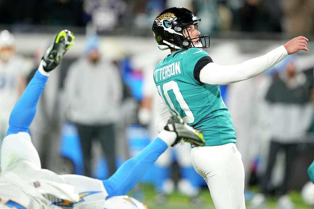 Jacksonville Jaguars place kicker Riley Patterson (10) watches his game-winning field goal during the second half of an NFL wild-card football game against the Los Angeles Chargers, Saturday, Jan. 14, 2023, in Jacksonville, Fla. Jacksonville Jaguars win 31-30.