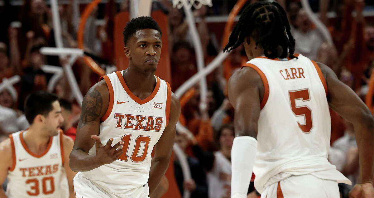 Sir'Jabari Rice #10 of the Texas Longhorns and teammate Marcus Carr #5 react as they defeat the Texas Tech Red Raiders 72-70 in the second half of the game at the Moody Center on January 14, 2023 in Austin, Texas. (Photo by Chris Covatta/Getty Images)