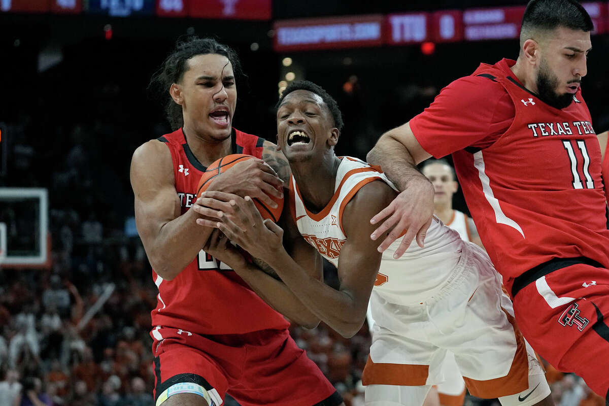Texas guard Sir'Jabari Rice, center, battling Texas Tech's Jaylon Tyson and Fardaws Aimaq for a loose ball, is one of several players on Longhorns who started at other programs and brings a different attitude.