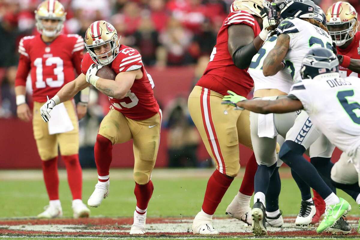 San Francisco 49ers’ Christian McCaffrey rushes during 3rd quarter of Niners’ 41-23 win over Seattle Seahawks in NFC Wild Card Playoffs in Santa Clara, Calif., on Saturday, January 14, 2023.