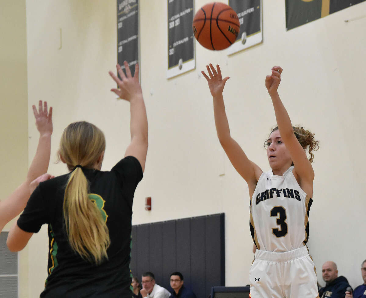 Father McGivney's Emma Martinez puts up a 3-pointer against Southwestern on Saturday in Glen Carbon.