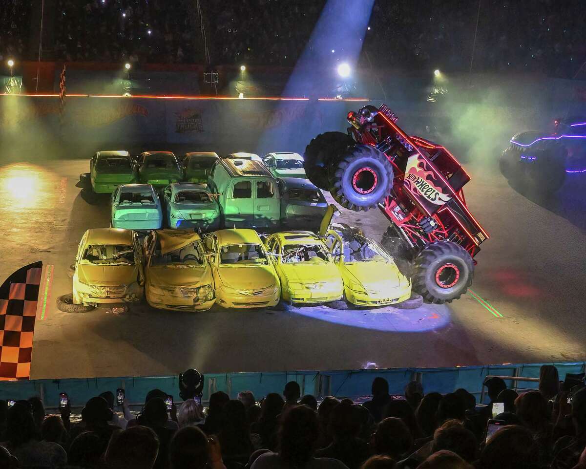 Bonecrusher races over five cars in the unicycle competition at the Hot Wheels Monster Trucks Live Glow Party held at the MVP Arena in Albany, NY on Saturday, January 14, 2023.