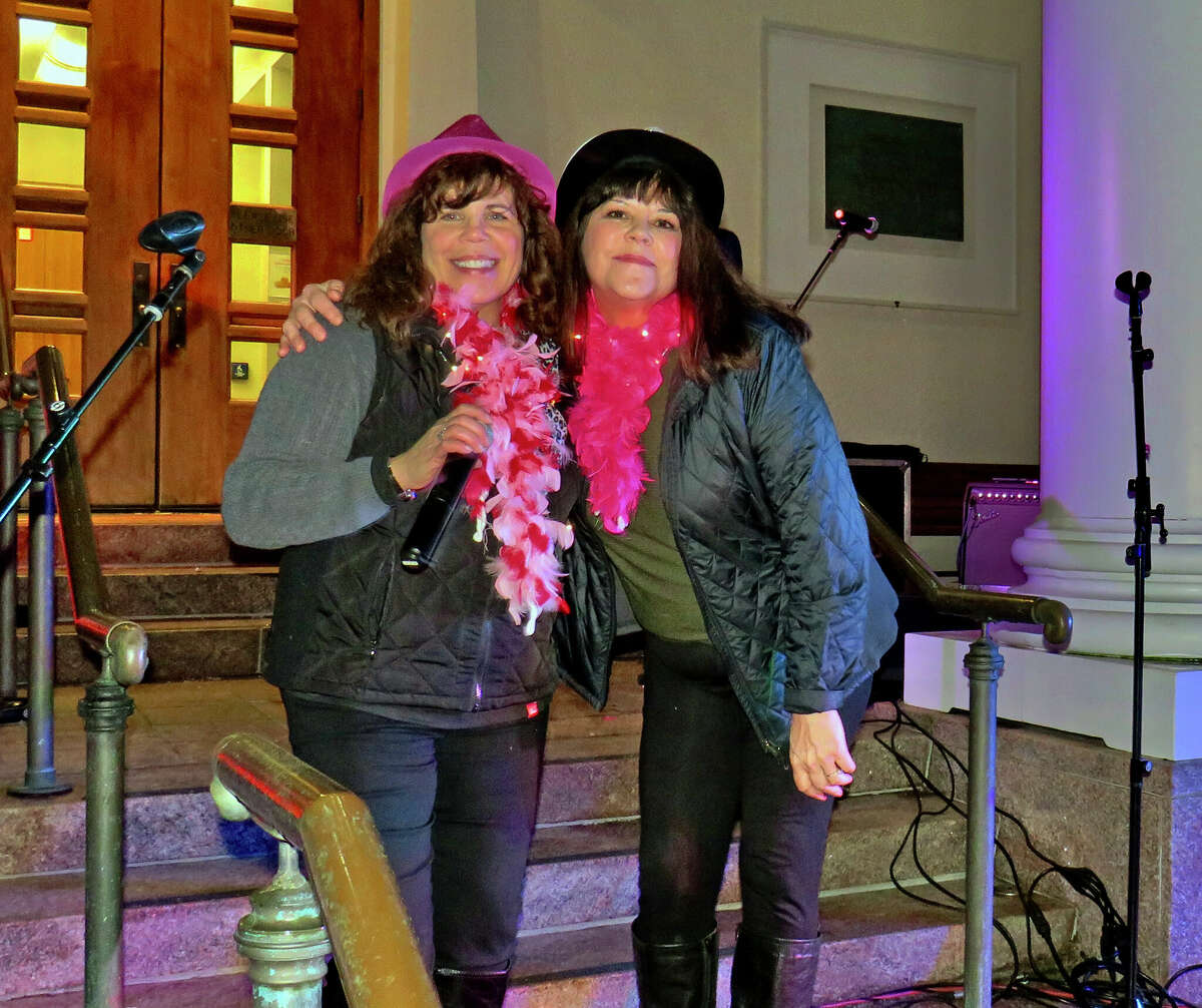 Sin Sisters Janice Ingarra and Kathy Kessler taking a break from performing at "First Night"  celebration on Branford Green on Friday, Jan. 6.