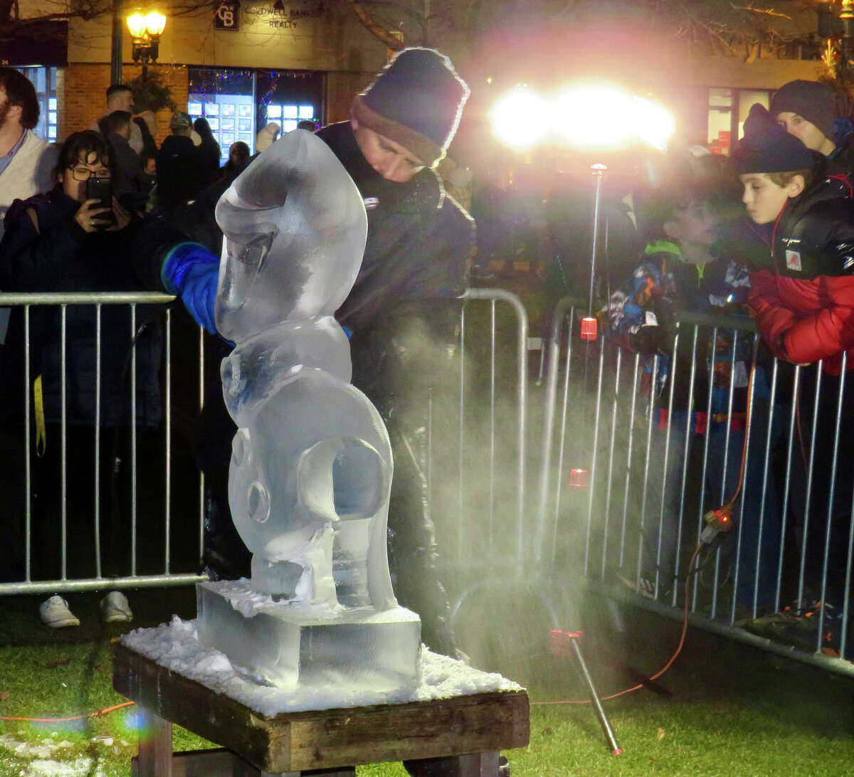 Bill Covitz of Ice Matters sculpting Olaf from "Frozen" at "First Night" celebration on Branford Green on Friday, Jan. 6.