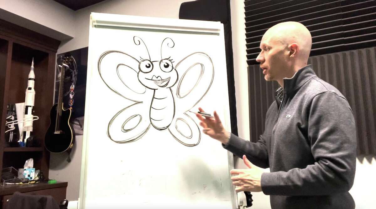 Greenwich native Phil Lohmeyer of The Comic Tree draws his original character, Wingslie the Butterfly, on a whiteboard at Makeinspires Mamaroneck.  The character is one of 8 that will be taught and animated as part of the 2D Animation Clinic starting on January 23.