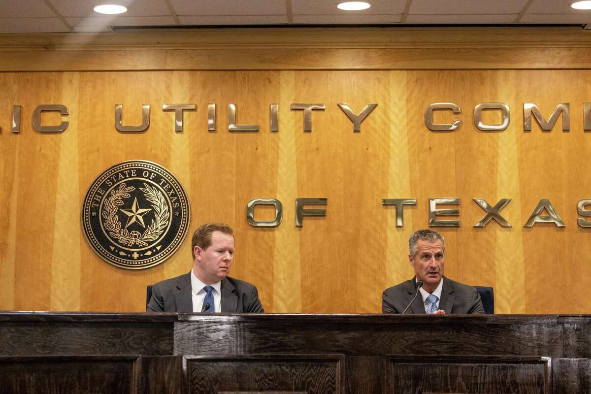 Peter Lake, left, chair of the Public Utility Commission of Texas, and Brad Jones, then-interim president and CEO of the Electric Reliability Council of Texas, speak at a May 17 press conference about the state's power grid.