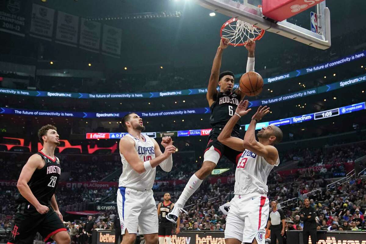 Houston Rockets forward Kenyon Martin Jr. (6) dunks over Los Angeles Clippers forward Nicolas Batum (33) during the first half of an NBA basketball game Sunday, Jan. 15, 2023, in Los Angeles. (AP Photo/Marcio Jose Sanchez)
