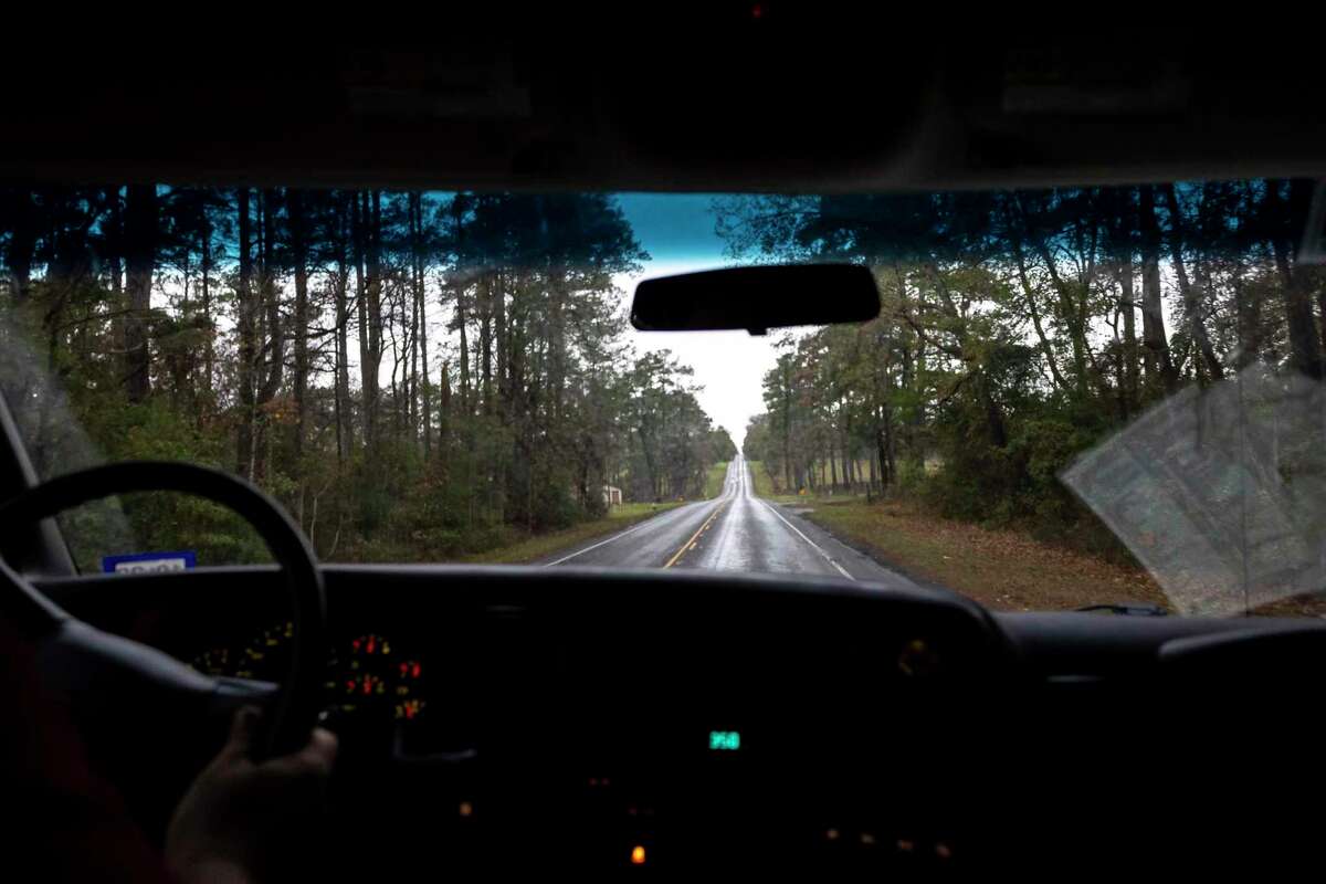 Tall pine trees line the sides of Texas 94 outside of Groveton. EMTs face obstacles like unreliable cellphone coverage and long distances when responding to rural emergencies.