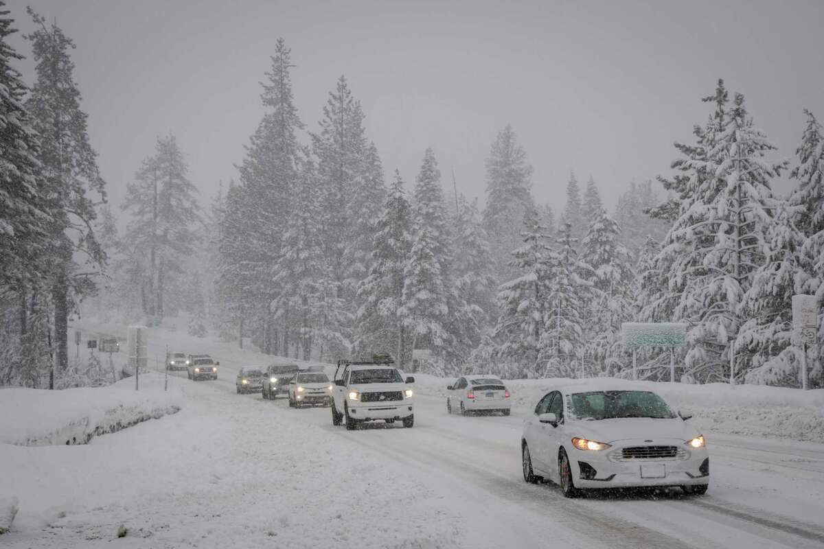 Vehicles marque   their mode   down   Highway 50 toward South Lake Tahoe aboriginal  this month. Travel conditions aft  play   storms successful  the mountains are treacherous.