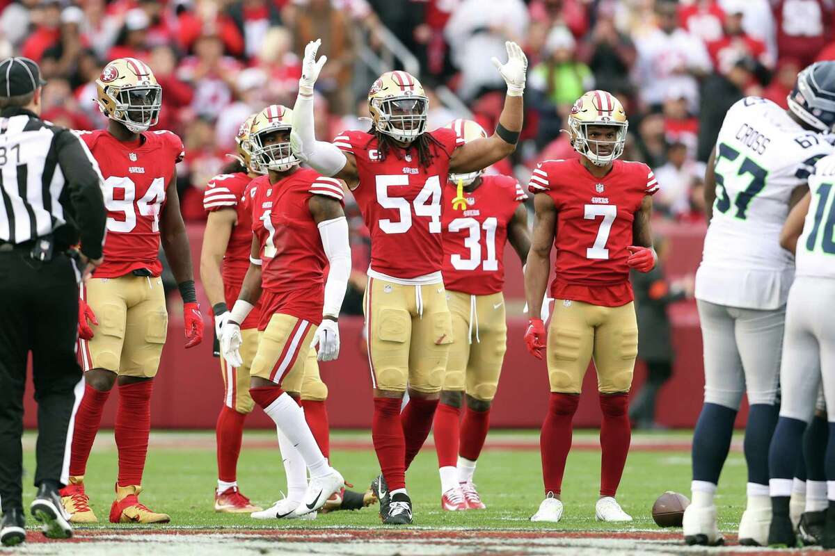 49ers’ linebacker Fred Warner fires up the crowd in the win over Seattle. “We try to keep teams to damn near zero, to make it as easy as possible on that kid (QB Brock Purdy),” Warner said.