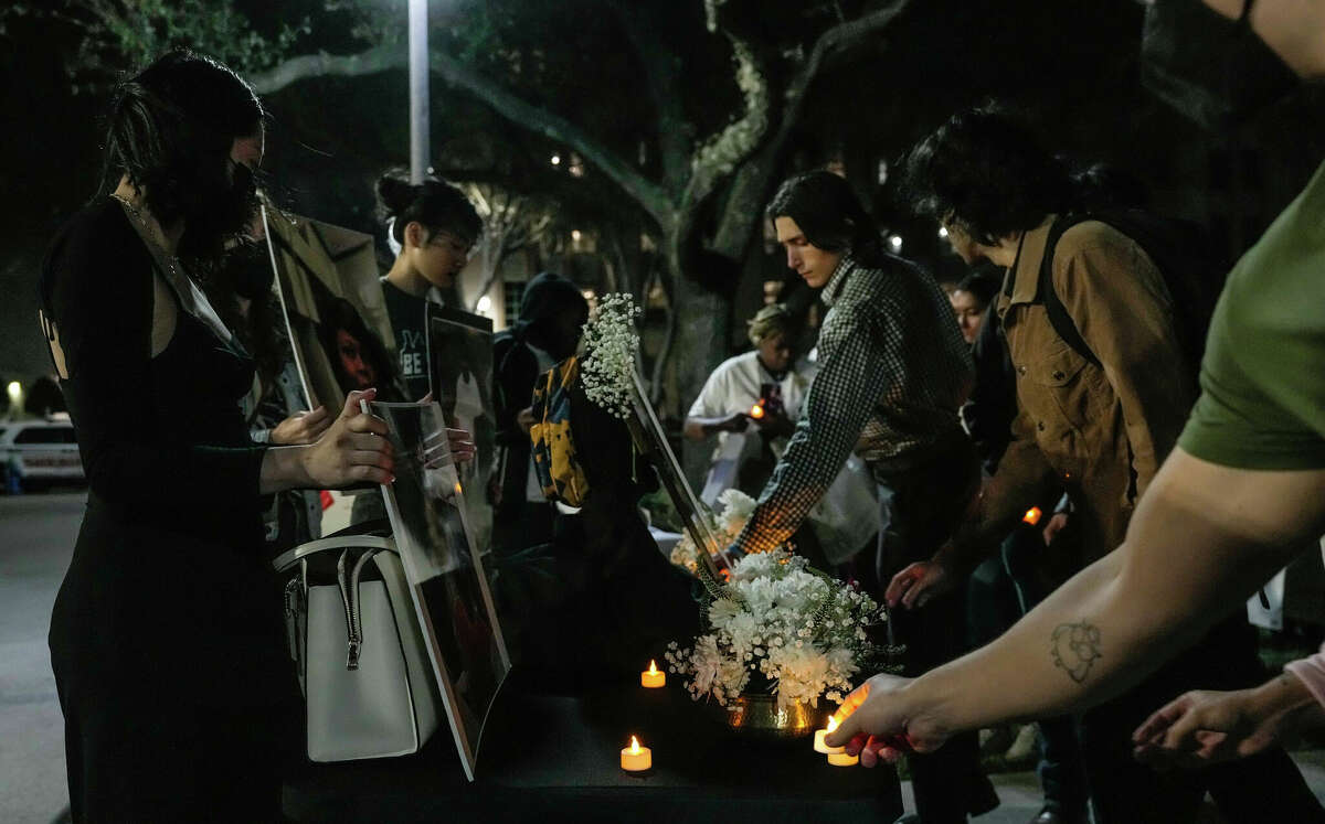 Attendees lay electronic candles on a table during a vigil for the 29 people who have died in Harris County Jail since the start of last year on Sunday, Jan. 15, 2023, at Harris County Jail in Houston.