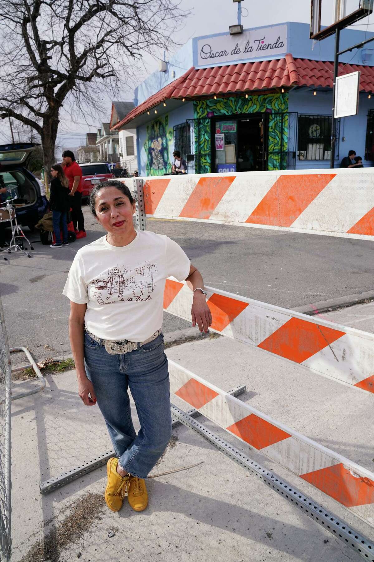 Owner Cynthia Gomez smiles during a benefit Sunday to help raise funds for Oscar de la Tienda, an eclectic convenience store in the Alta Vista neighborhood that serves as a hub for other small businesses and local artists without brick and mortar shops of their own. Gomez said construction has severely impacted business and the store is “hanging on by a thread, operating at 25% of what average revenues should be.”