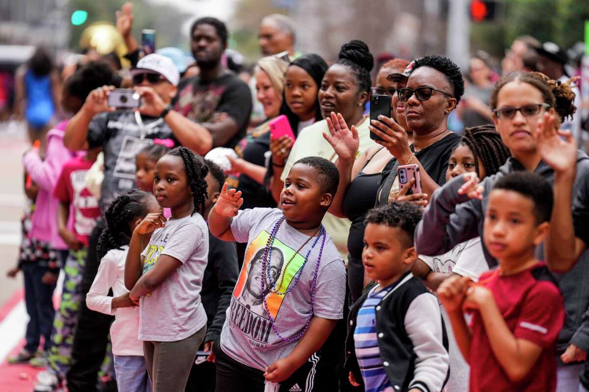People line the parade route watching the 45th Annual Original MLK Day Parade downtown on Monday, Jan. 16, 2023 in Houston.