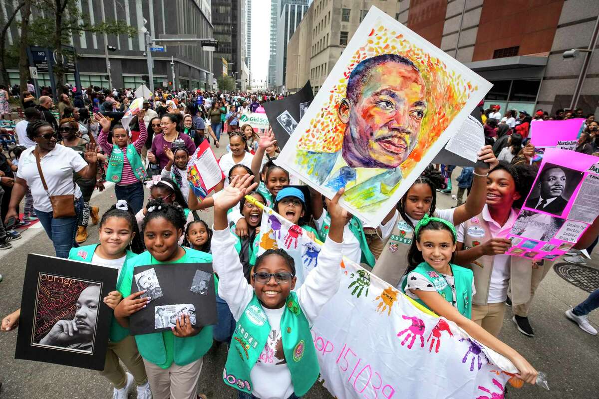 Girl Scouts march together during the 45th Annual Original MLK Day Parade downtown on Monday, Jan. 16, 2023 in Houston.