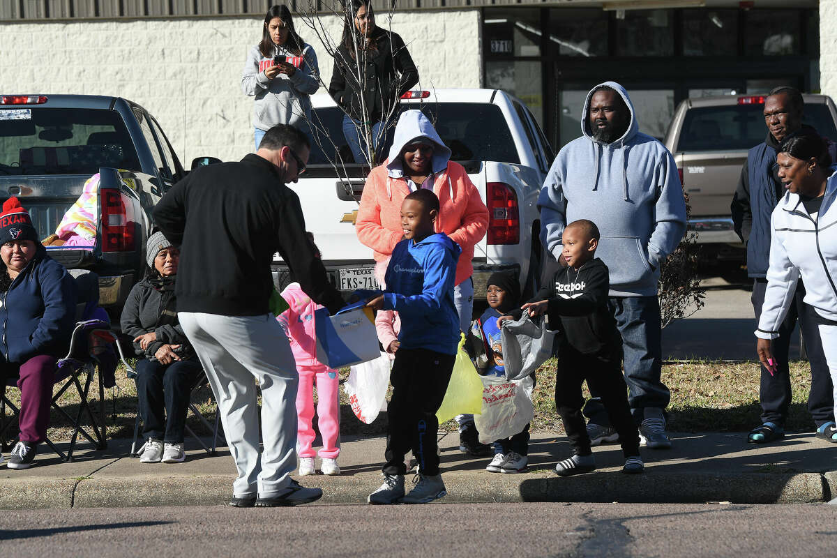 A crowd lines the route as the Martin Luther King, Jr., parade makes its way up Highland Avenue Saturday. Photo made Saturday, January 14, 2023 Kim Brent/Beaumont Enterprise