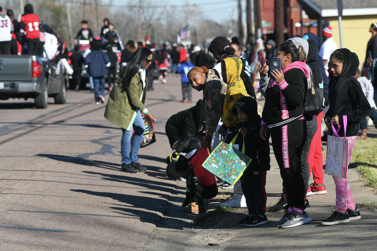 A crowd lines the route as the Martin Luther King, Jr., parade makes its way up Highland Avenue Saturday. Photo made Saturday, January 14, 2023 Kim Brent/Beaumont Enterprise