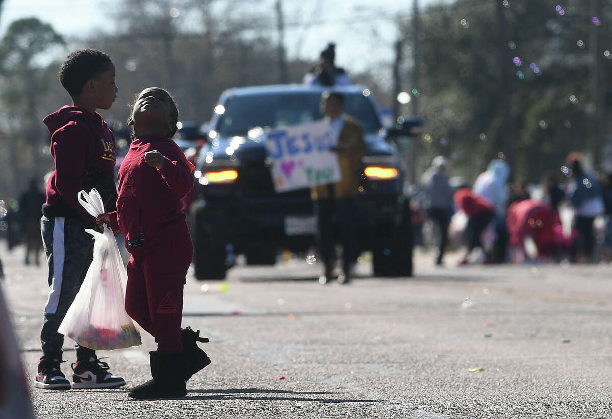 A crowd lines the route as the Martin Luther King, Jr., parade makes its way up Highland Avenue Saturday. Photo made Saturday, January 14, 2023 Kim Brent/Beaumont Enterprise