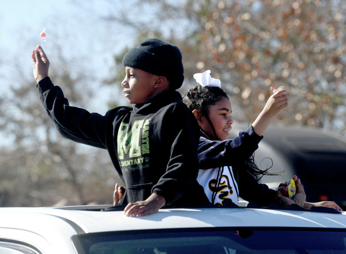 A crowd lines the route as the Martin Luther King, Jr., parade makes its way up Highland Avenue Saturday. Photo made Saturday, January 14, 2023 Kim Brent/Beaumont Enterprise