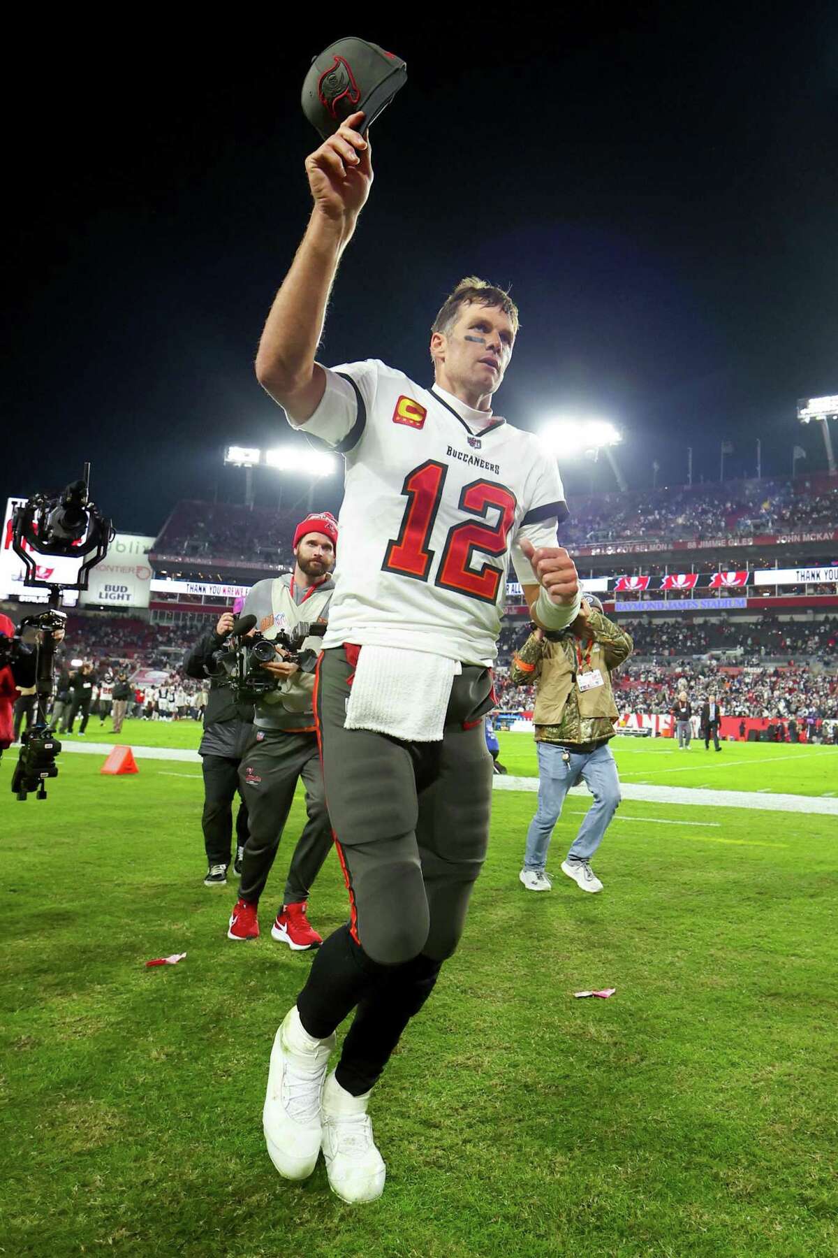 TAMPA, FLORIDA - JANUARY 16: Tom Brady #12 of the Tampa Bay Buccaneers walks off the field after losing to the Dallas Cowboys 31-14 in the NFC Wild Card playoff game at Raymond James Stadium on January 16, 2023 in Tampa, Florida. (Photo by Mike Ehrmann/Getty Images)