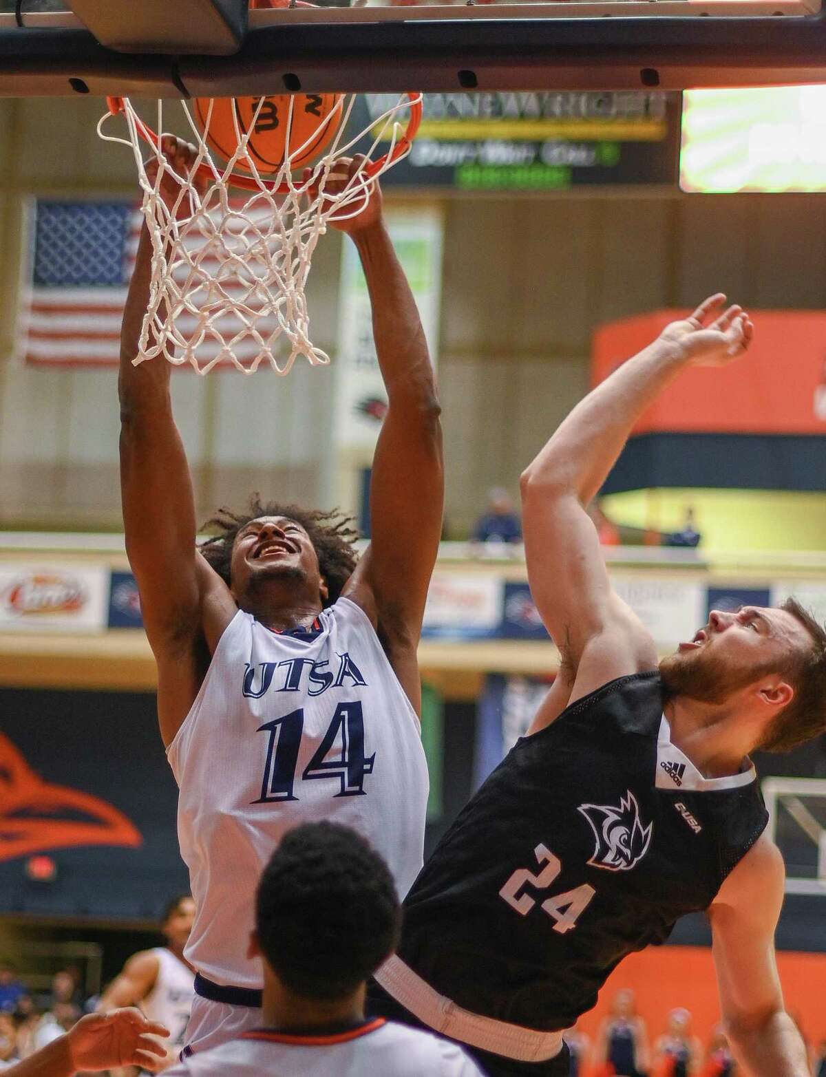 UTSA’s Massal Diouf received a technical foul for hanging on the rim on this attempted dunk against Rice’s Jake Lieppert during Monday night’s game at the Convocation Center.