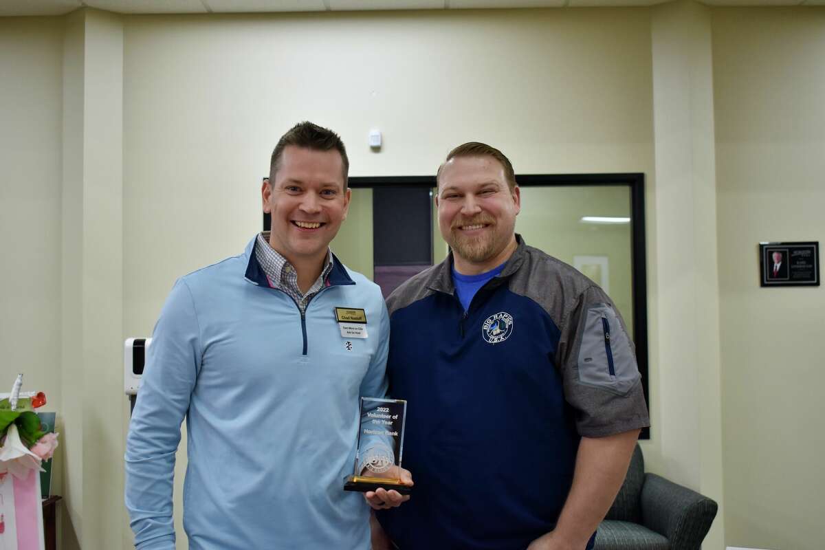 Big Rapids Horizon Bank Branch Manager Chad Nastoff (left) accepted the Volunteer of the Year award from the Big Rapids Downtown Business Association and representative Josh Pyles (right).