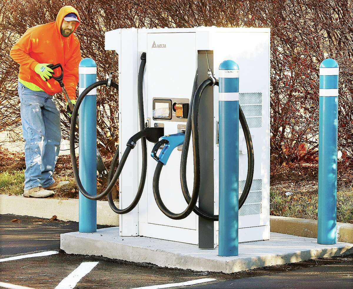 John Badman|The Telegraph Workers in November were finalizing three electric vehicle charging stations, with multiple hookups, in Alton.