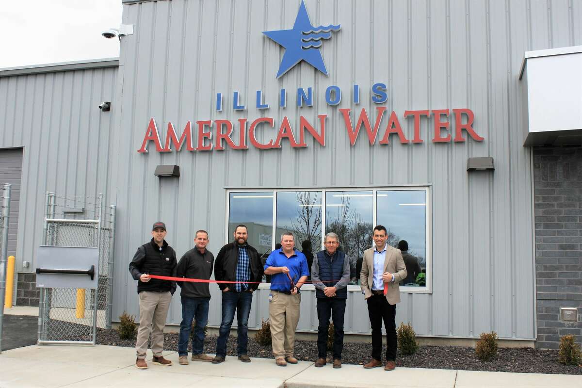 Officials celebrate the completion of an Illinois American Water facility project in Jerseyville. Among those attending a ribbon-cutting were Stu Bailey (from left), Helmkamp project manager; Randy Houck, Helmkamp superintendent; Ric Cooper, senior design engineer-wastewater; Brendan St. Peters, senior supervisor-water and wastewater operations; Jerseyville Mayor Bill Russell; and Ethan Steinacher, senior manager-operations.