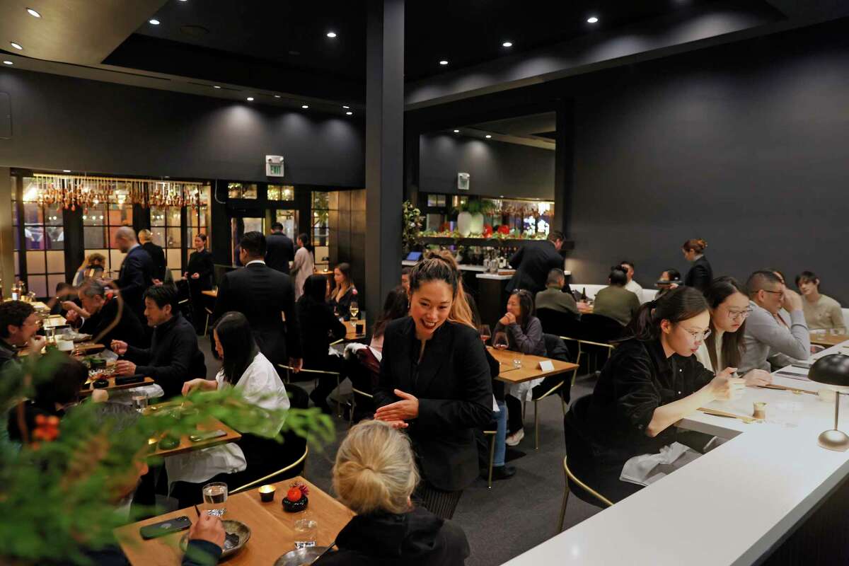 Top: Chef David Yoshimura leads the kitchen at Nisei. Above: The San Francisco restaurant was bustling on a recent evening.
