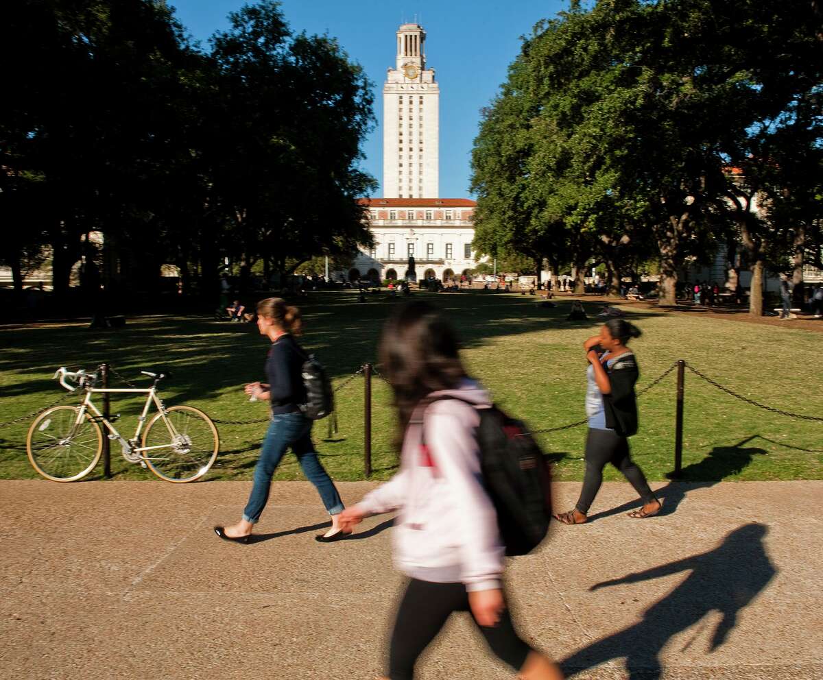 University of Texas students and faculty make their way through campus via the UT Tower.
