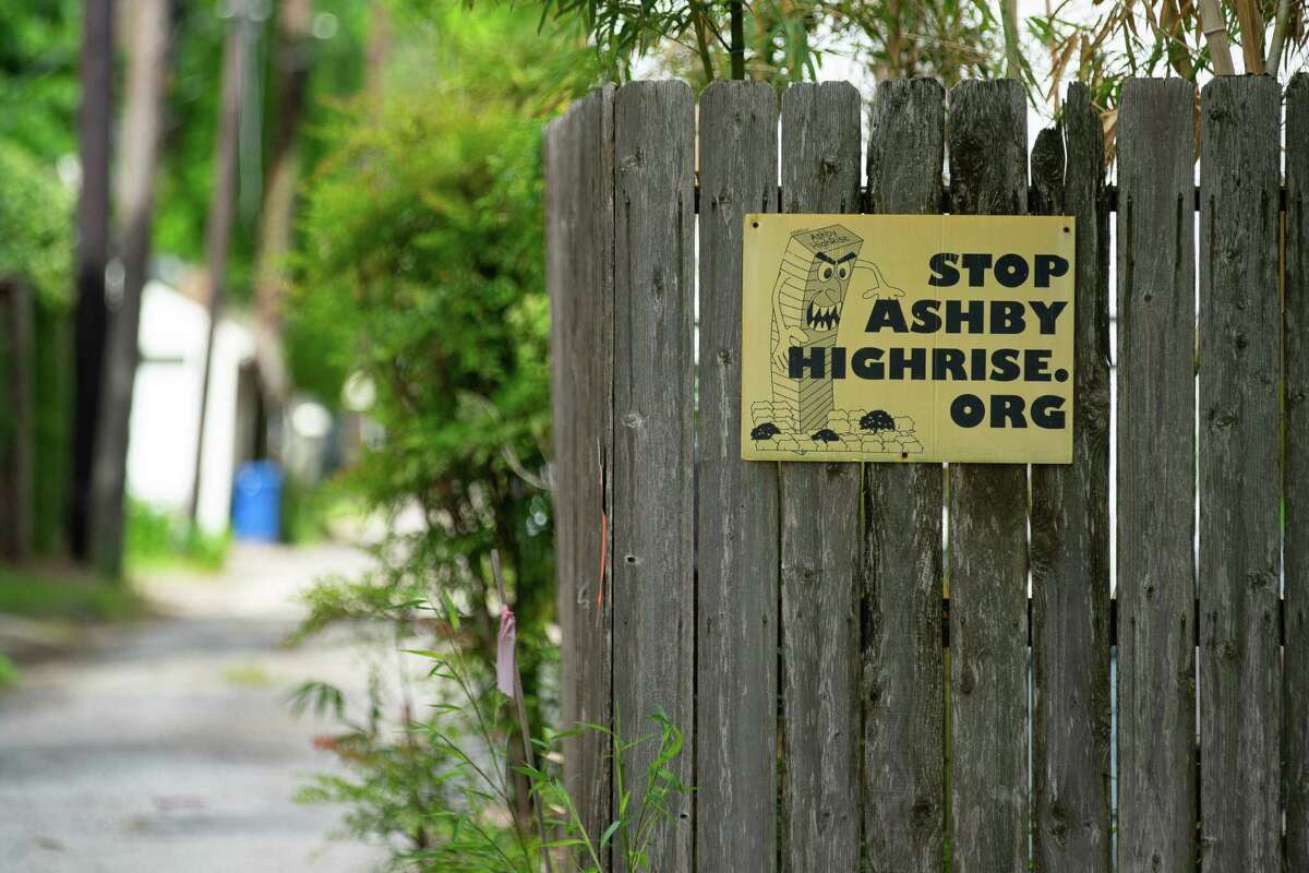 A “Stop Ashby Highrise” sign hangs on a fence across the street from the vacant property at 1717 Bissonnet Street at Ashby Street in the Boulevard Oaks neighborhood, Friday, April 29, 2022, in Houston. Residents fought the Ashby project for years, saying it would degrade their neighborhood. Among other issues, residents called for greater buffer zones between their homes and the proposed high-rise. 